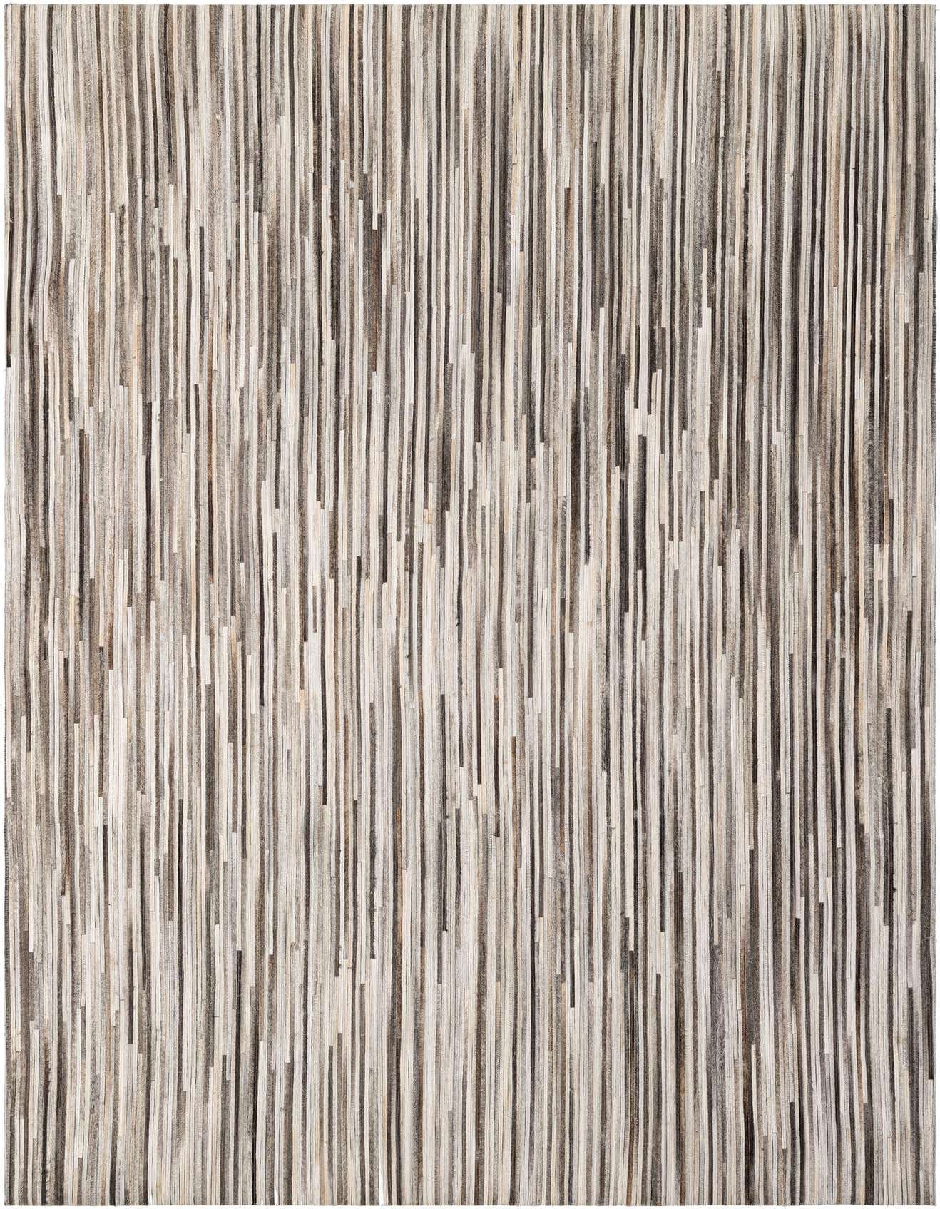 A 5x8 rectangular Cowhide Patchwork rug featuring vertical stripes in various shades of multi-colored brown, grey, and cream.
