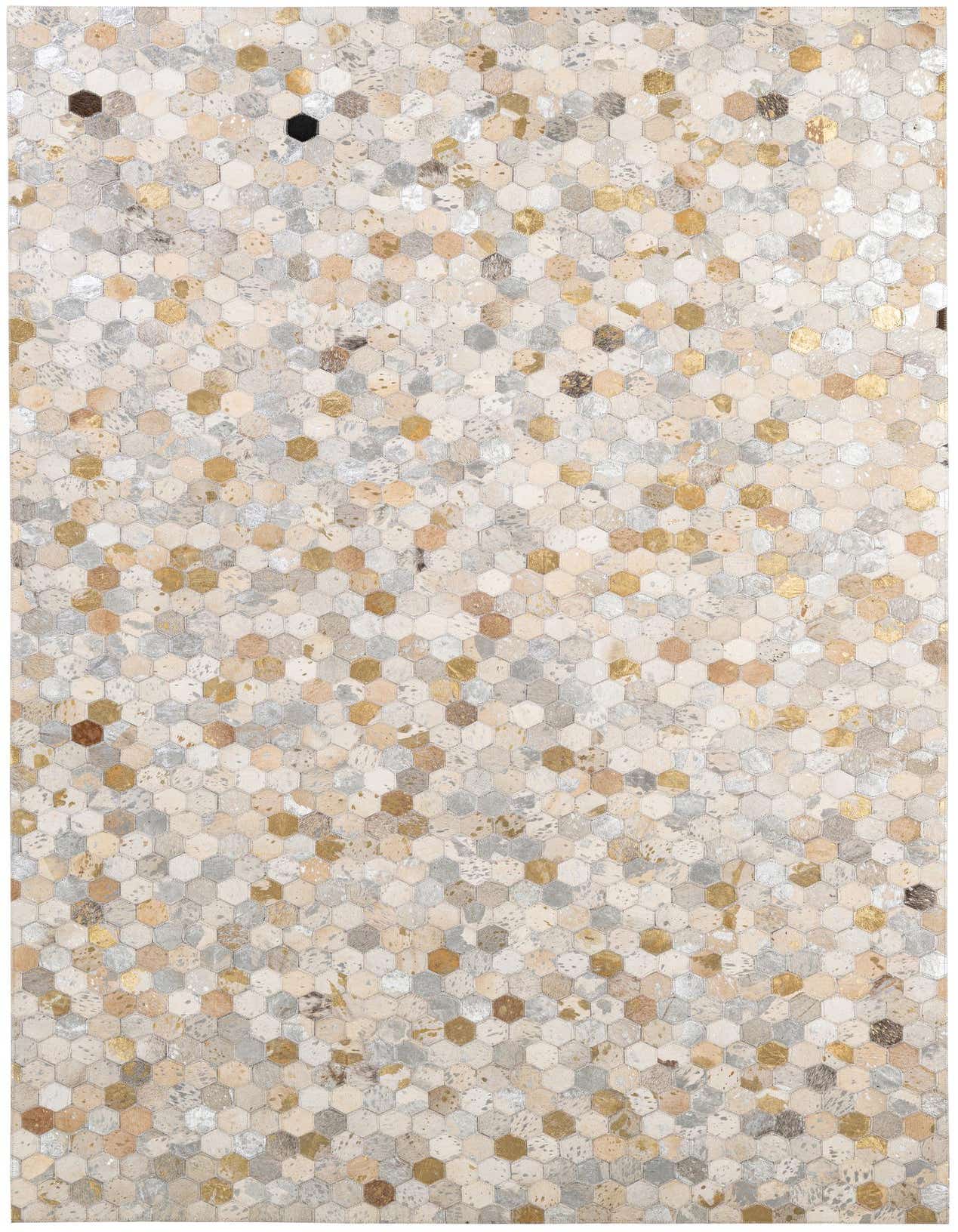 A rectangular 5x8 modern patchwork rug made of multi-colored cowhide and leather hexagons, featuring shades of cream, grey, brown, and metallic gold.