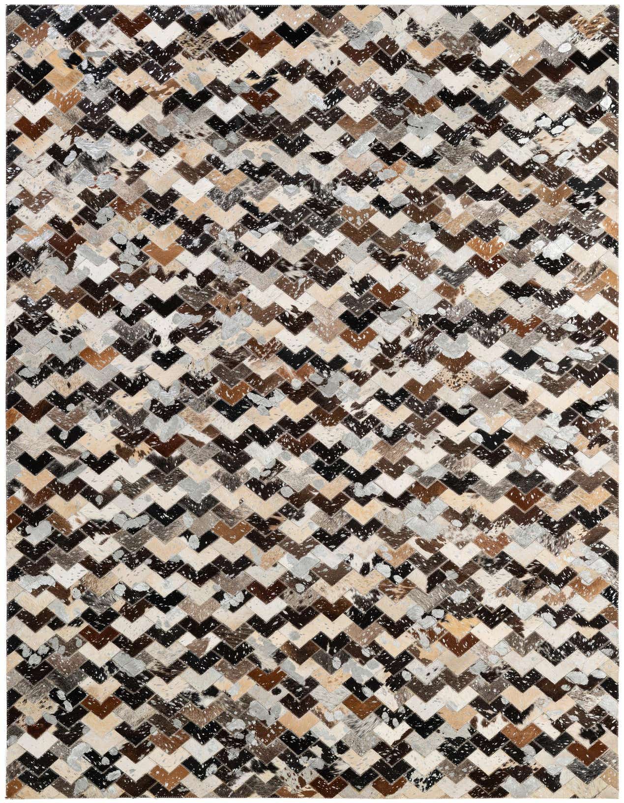 A 5x8 rectangular multi-colored cowhide rug with a modern chevron patchwork pattern, ideal for a living room.
