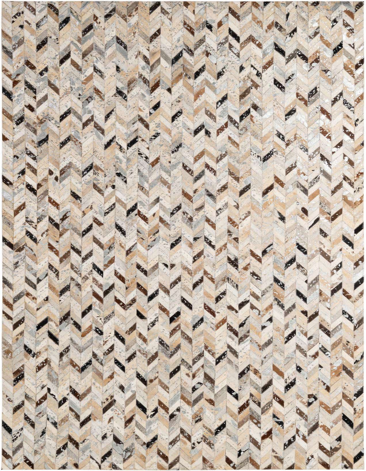 A 5x8 rectangular Cowhide Patchwork rug featuring a modern chevron pattern in multi-colored natural hide tones.