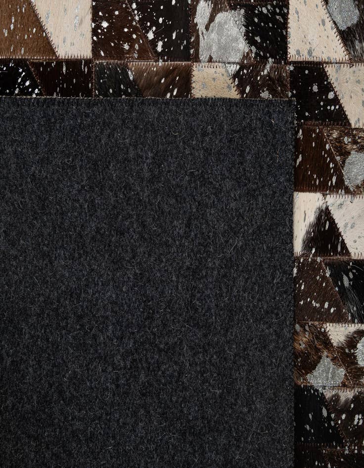 Detail image of  5' 1 x 7' 11 Cowhide - Patchwork Rug