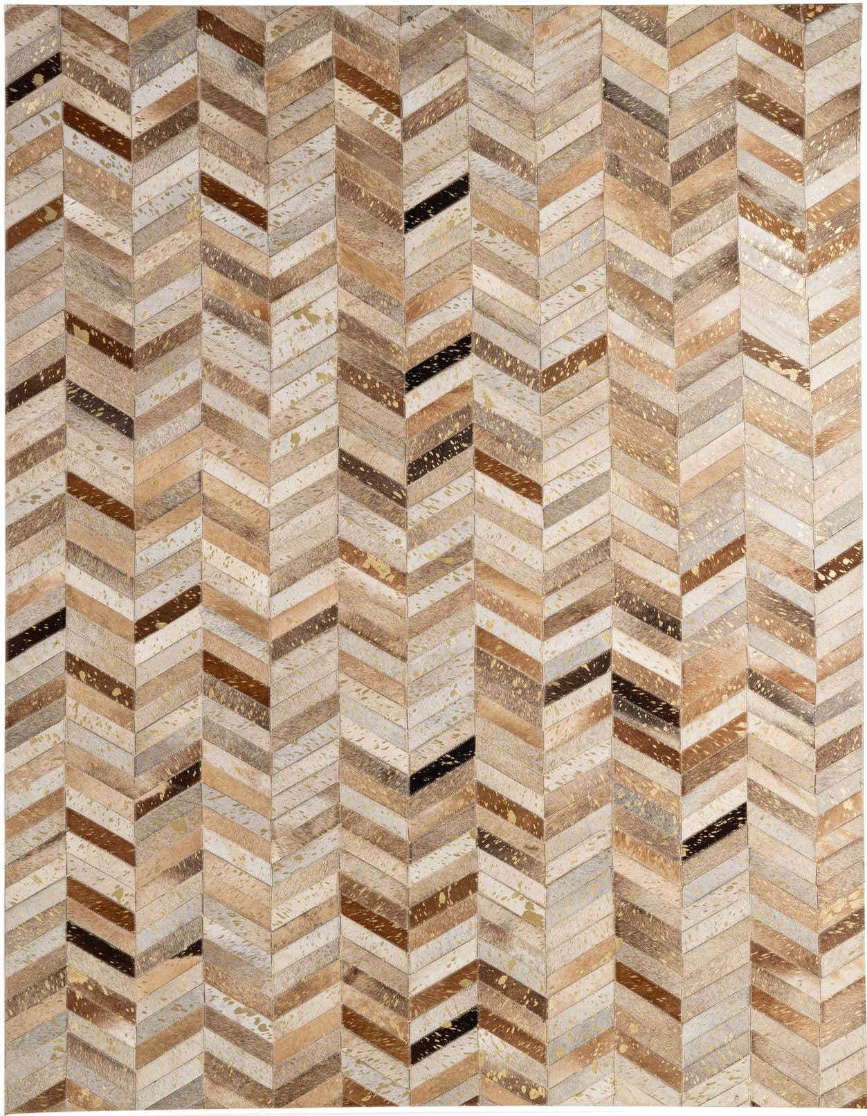 A 5x8 rectangular Cowhide - Patchwork rug with a modern multi-colored chevron pattern, featuring natural browns, creams, and black with gold speckles.