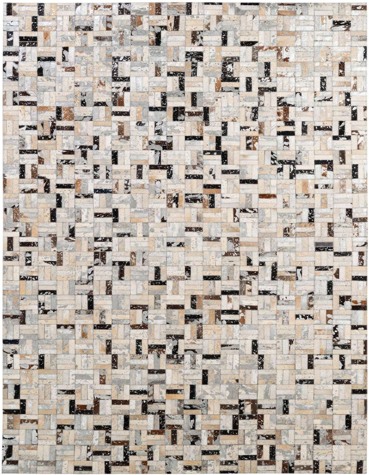 A rectangular 5x8 modern patchwork cowhide rug with multi-colored squares and rectangles in shades of white, black, brown, and gray.