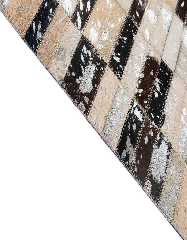 Detail image of  4' 11 x 7' 10 Cowhide - Patchwork Rug