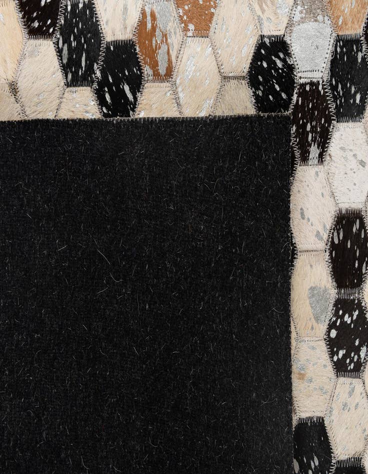 Detail image of  4' 11 x 7' 10 Cowhide - Patchwork Rug