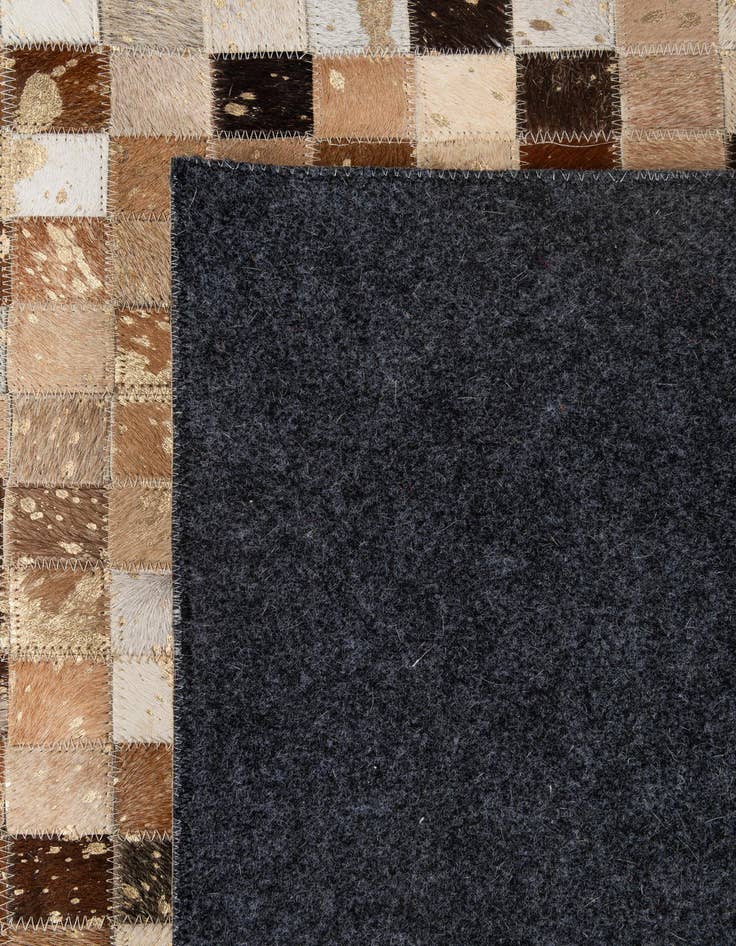 Detail image of  5' 1 x 7' 11 Cowhide - Patchwork Rug