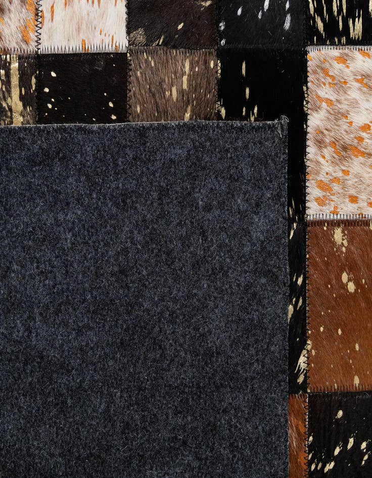 Detail image of  4' 11 x 7' 10 Cowhide - Patchwork Rug