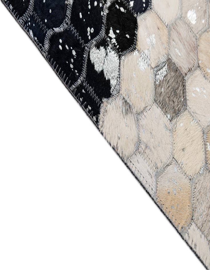 Detail image of  5' 1 x 7' 11 Cowhide - Patchwork Rug