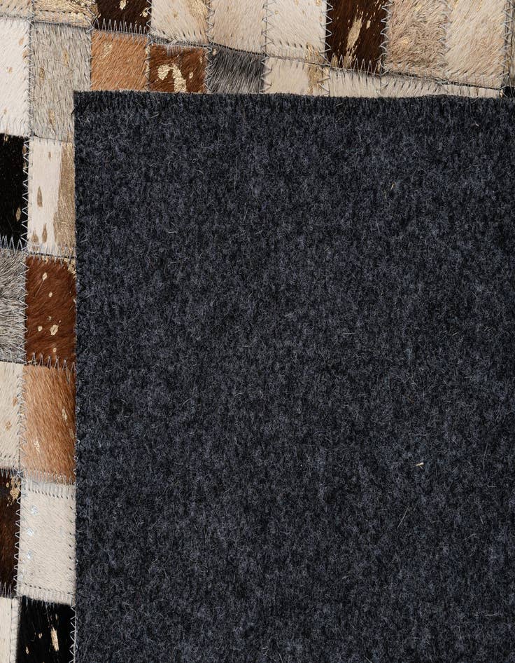Detail image of  4' 11 x 7' 10 Cowhide - Patchwork Rug