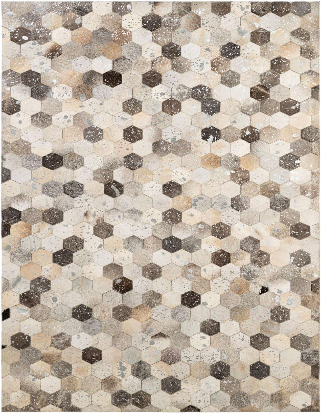 A 5x8 rectangular Cowhide Patchwork rug featuring a modern hexagonal pattern in multi-colored natural tones.