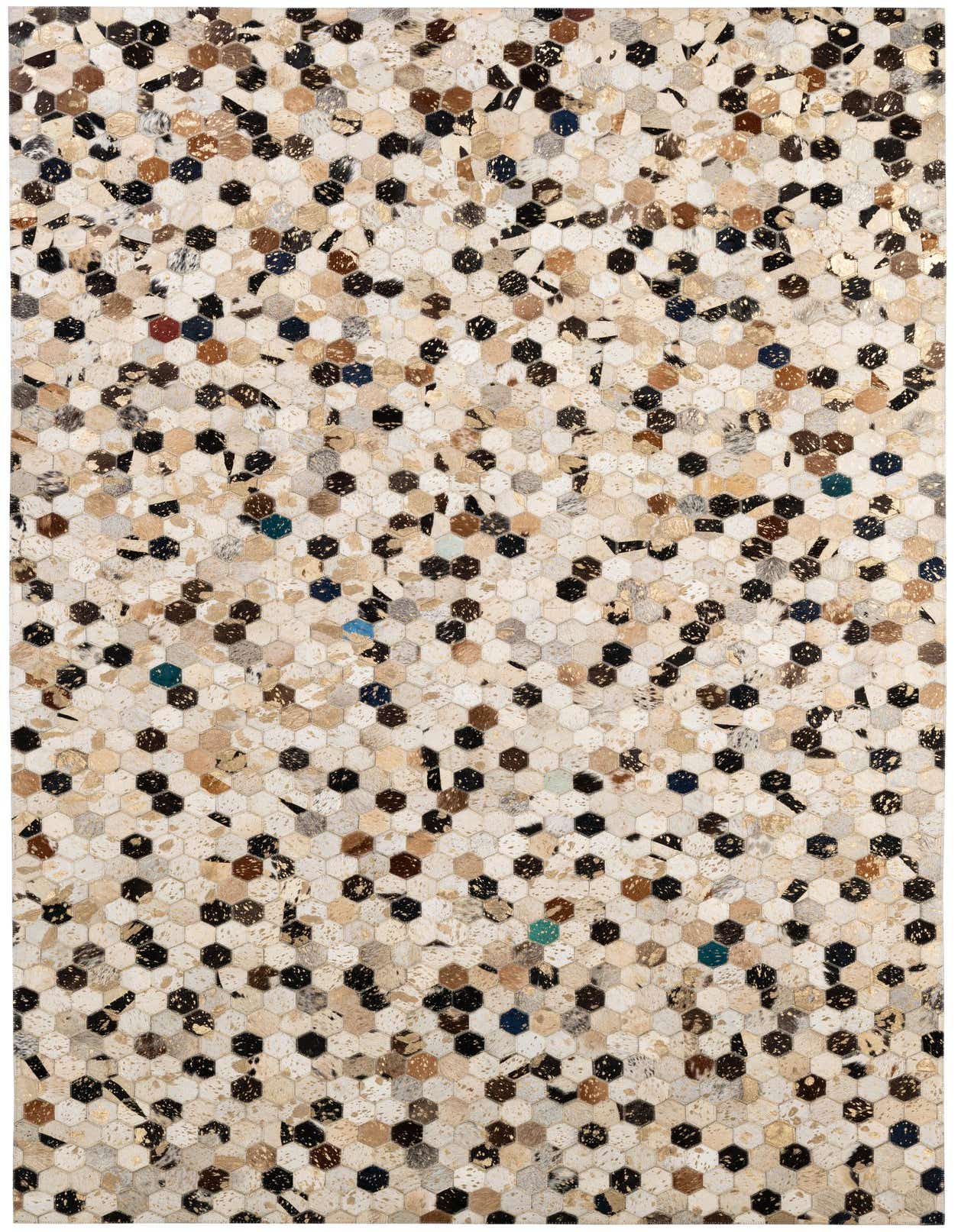 A 5x8 rectangular Cowhide Patchwork rug with a modern hexagonal pattern in multi-colored natural tones.