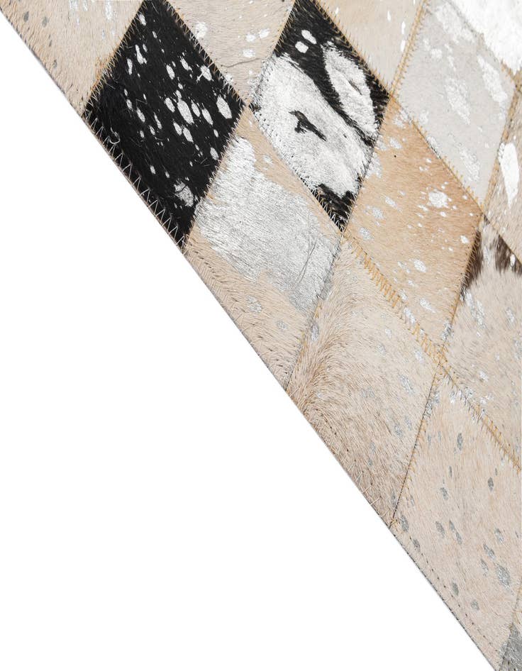 Detail image of  5' 1 x 7' 11 Cowhide - Patchwork Rug