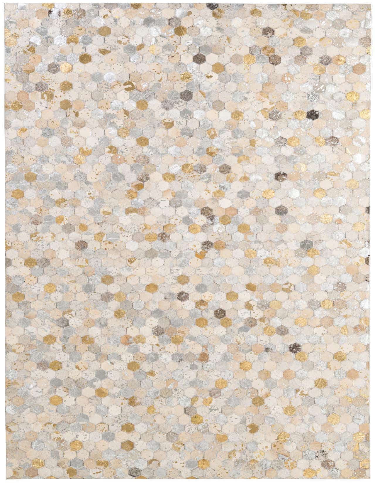 A 5x8 rectangular Cowhide Patchwork rug featuring a modern honeycomb pattern in multi-colored gold, silver, and natural hide tones.