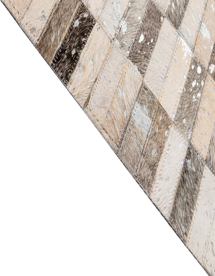 Detail image of  5' 1 x 7' 11 Cowhide - Patchwork Rug