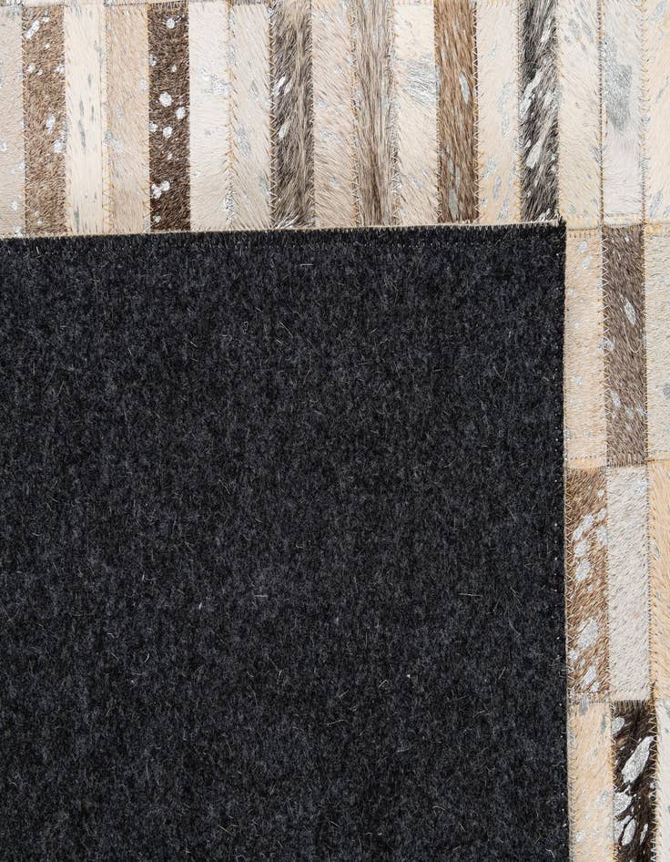 Detail image of  5' 1 x 7' 11 Cowhide - Patchwork Rug