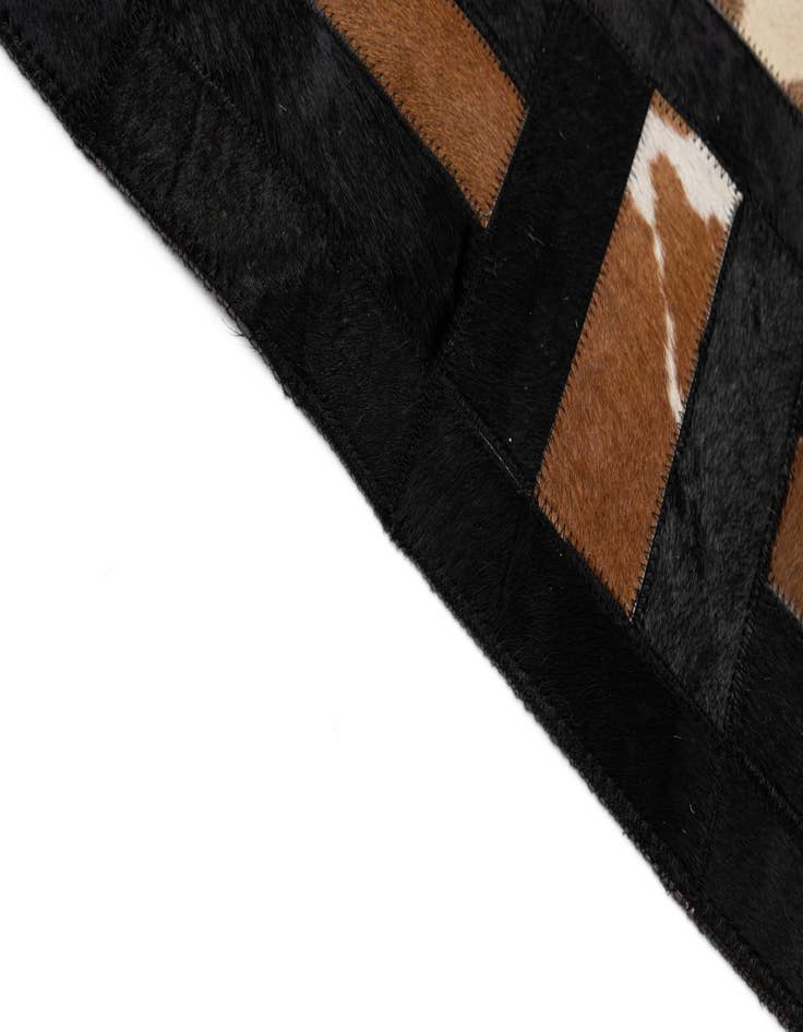 Detail image of  5' 3 x 8' 2 Cowhide - Patchwork Rug