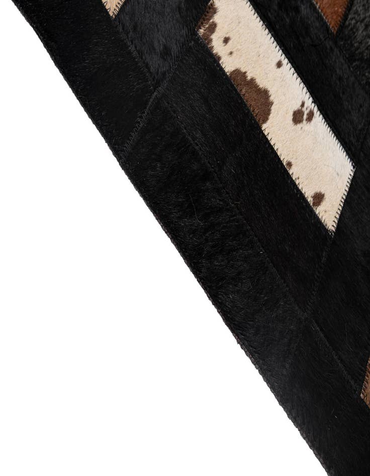 Detail image of  5' 3 x 8' 2 Cowhide - Patchwork Rug