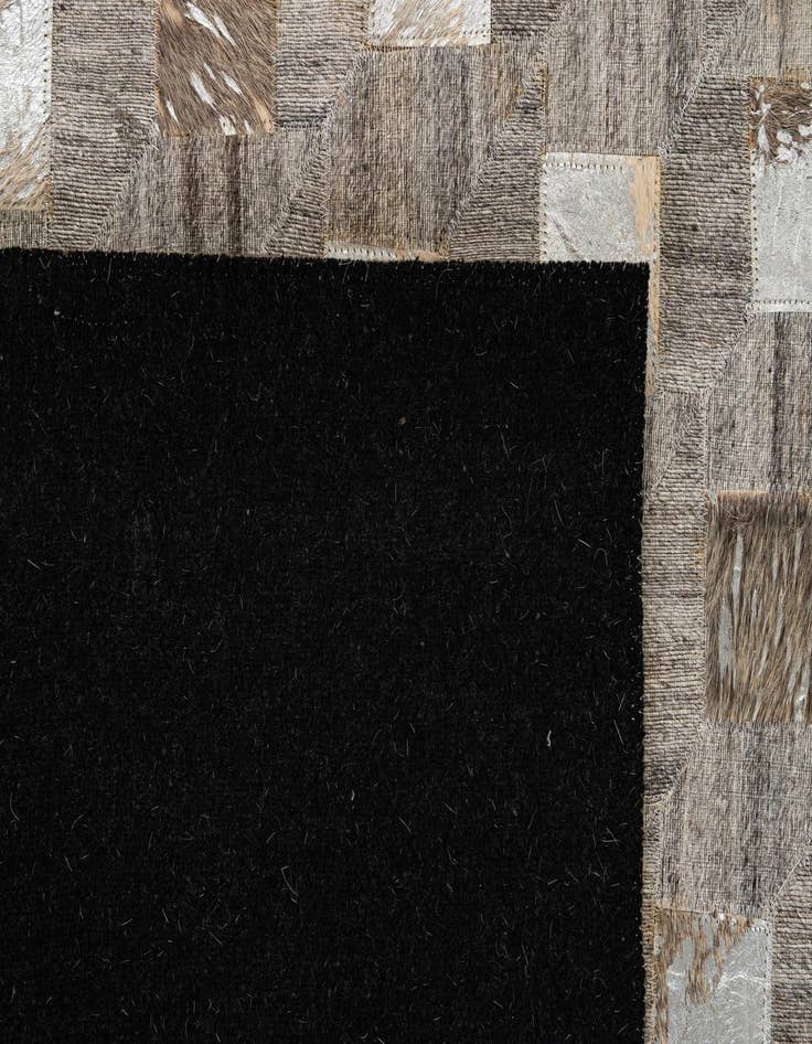 Detail image of  5' 2 x 7' 11 Cowhide - Patchwork Rug