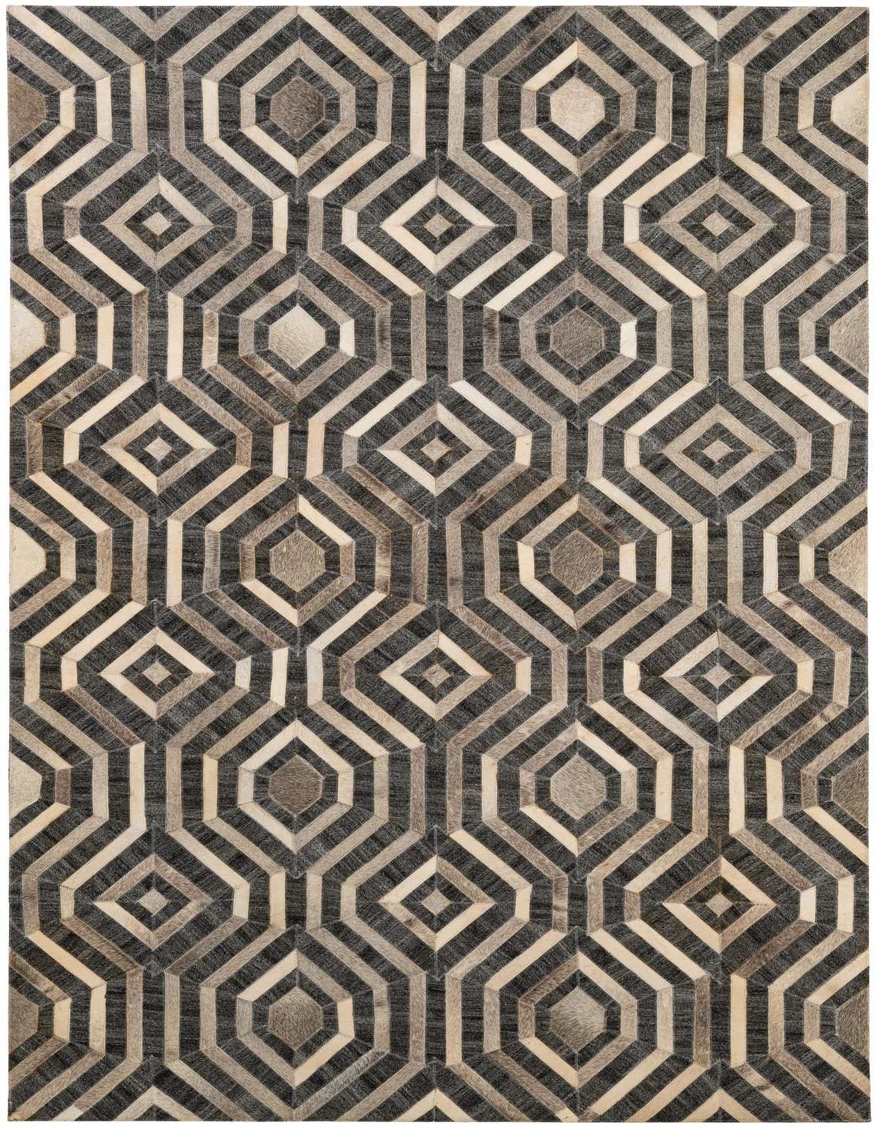 A 5x8 rectangular Cowhide Patchwork rug featuring a modern geometric pattern in multi-colored shades of gray, black, and cream.