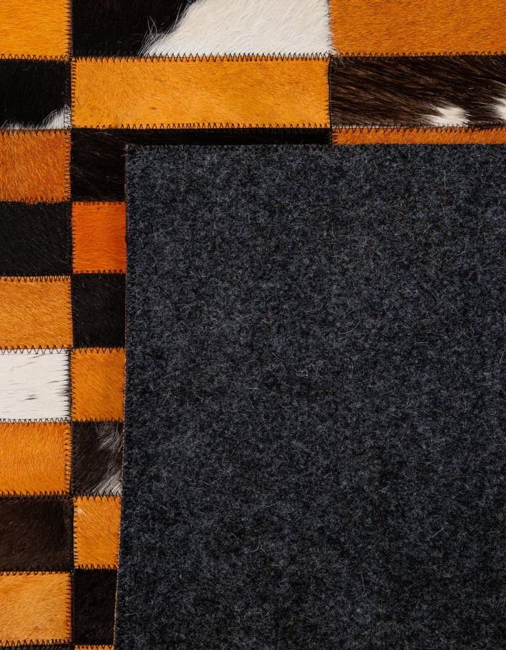 Detail image of  5' 1 x 7' 11 Cowhide - Patchwork Rug