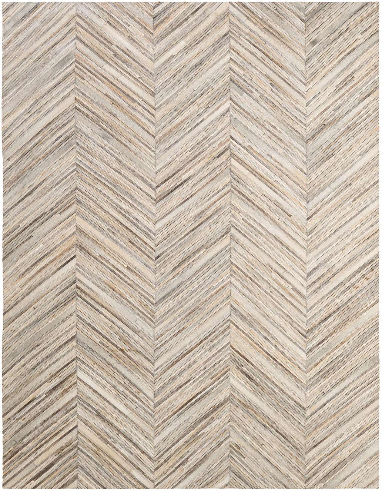 A 6x9 rectangular Cowhide - Patchwork rug featuring a modern chevron stripe pattern in multi-colored natural tones.