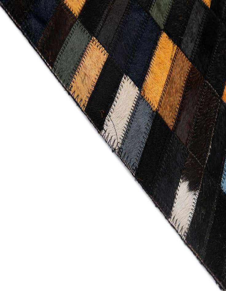 Detail image of  5' 2 x 7' 11 Cowhide - Patchwork Rug