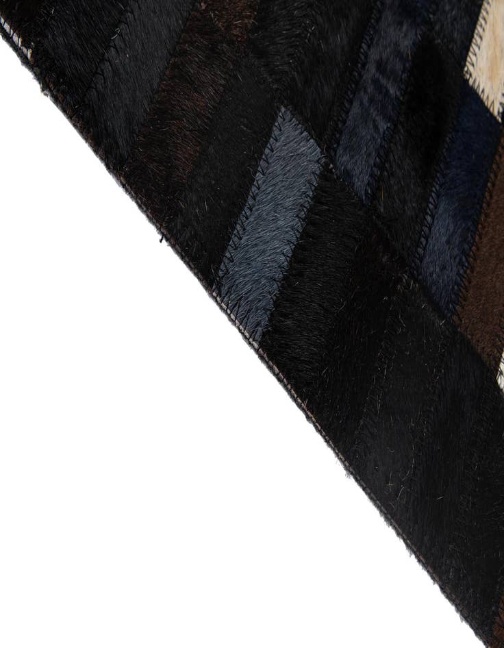 Detail image of  5' 3 x 7' 11 Cowhide - Patchwork Rug