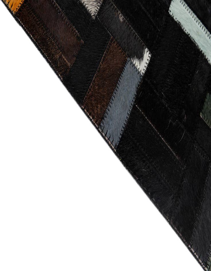 Detail image of  5' 1 x 7' 11 Cowhide - Patchwork Rug