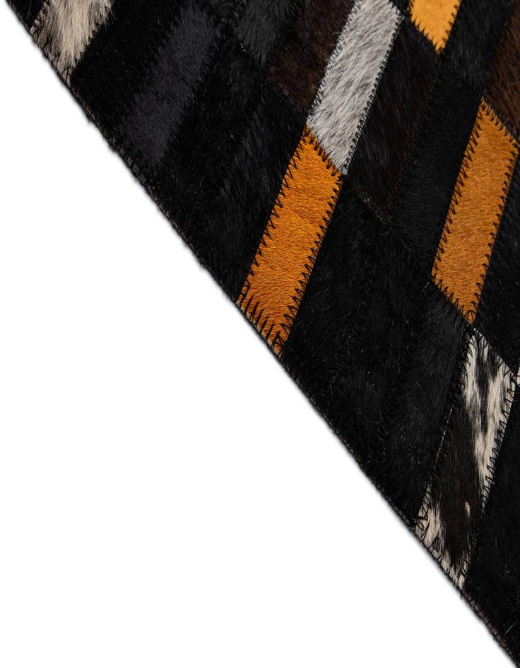 Detail image of  5' 2 x 7' 11 Cowhide - Patchwork Rug