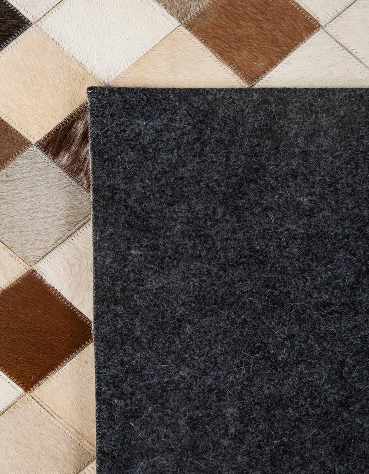 Detail image of  5' 1 x 7' 10 Cowhide - Patchwork Rug