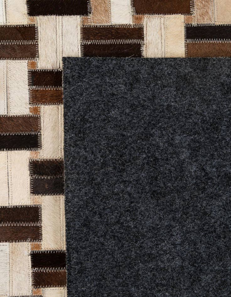 Detail image of  4' 11 x 7' 10 Cowhide - Patchwork Rug
