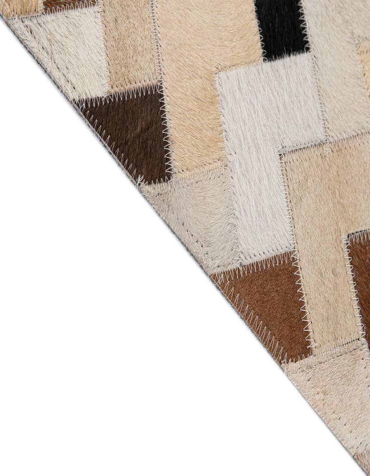 Detail image of  5' 1 x 7' 11 Cowhide - Patchwork Rug