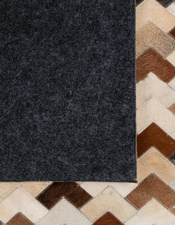 Detail image of  5' 1 x 7' 11 Cowhide - Patchwork Rug