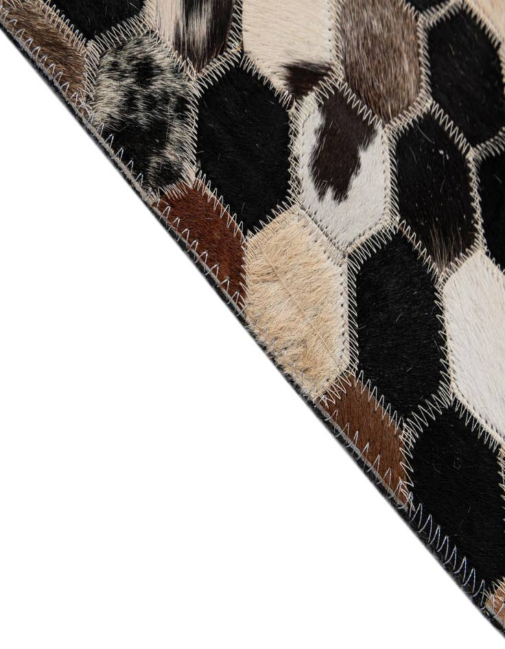 Detail image of  5' 1 x 7' 11 Cowhide - Patchwork Rug