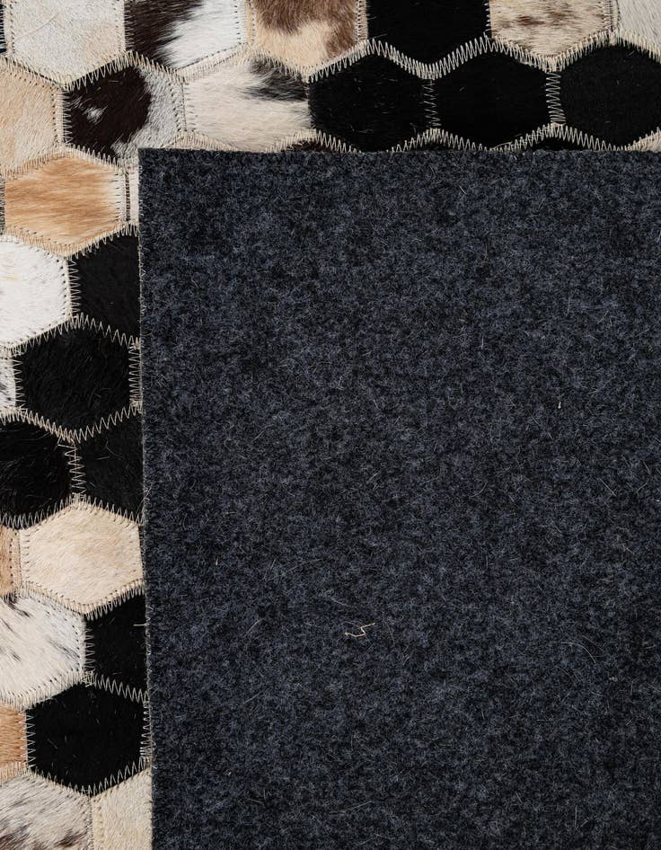 Detail image of  5' 1 x 7' 11 Cowhide - Patchwork Rug