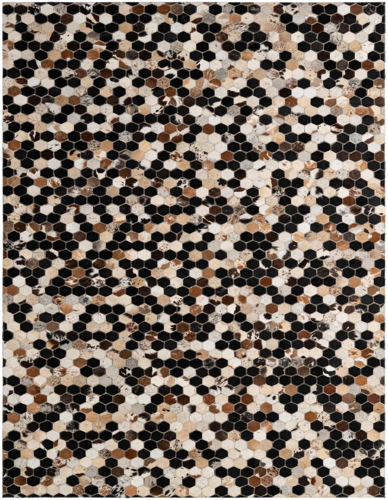 A rectangular 5x8 modern patchwork cowhide rug featuring hexagonal tiles in black, white, brown, and tan, suitable for a living room.