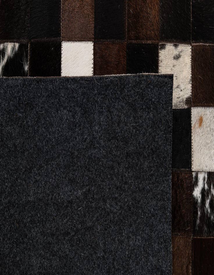 Detail image of  5' 2 x 7' 11 Cowhide - Patchwork Rug