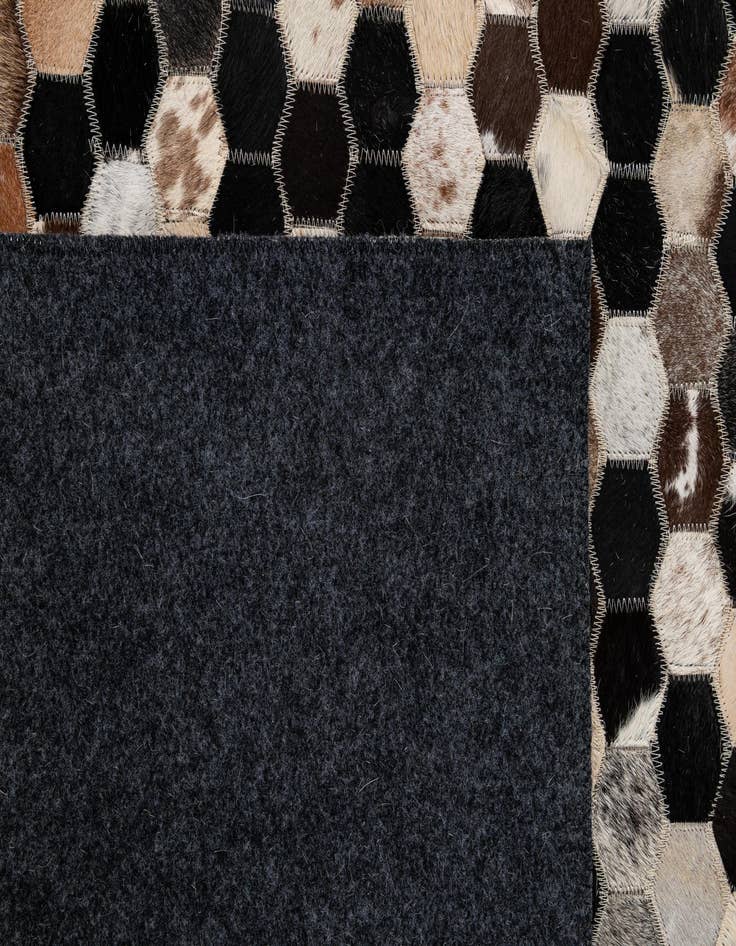 Detail image of  5' 1 x 7' 10 Cowhide - Patchwork Rug