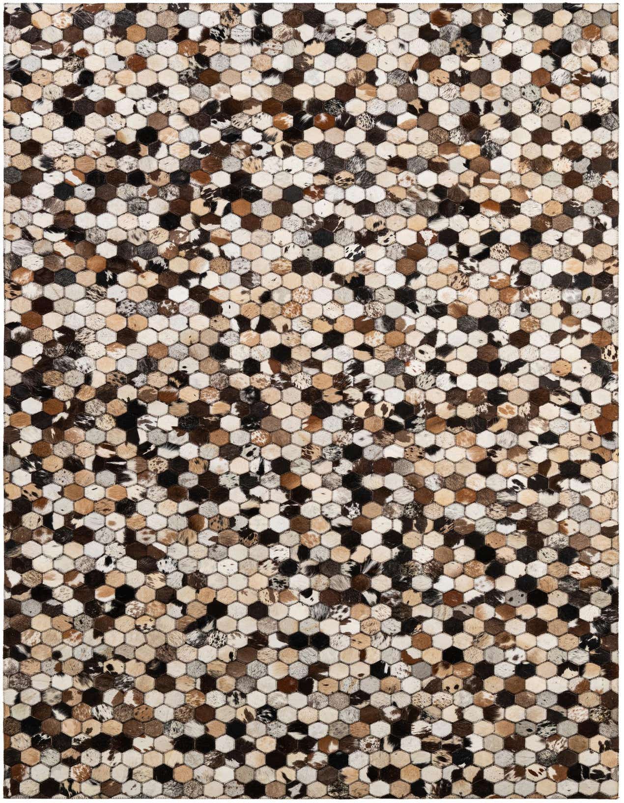 A 5x8 rectangular Cowhide Patchwork rug featuring a modern honeycomb pattern in various shades of brown, black, and white.