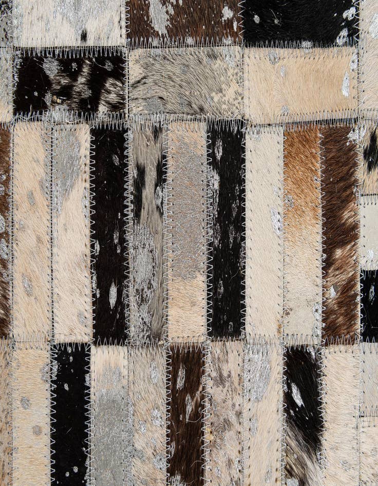 Detail image of  5' 1 x 7' 11 Cowhide - Patchwork Rug