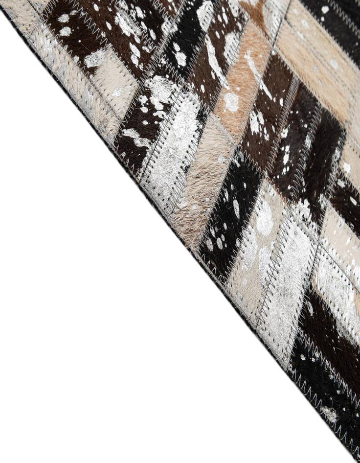 Detail image of  4' 11 x 7' 10 Cowhide - Patchwork Rug