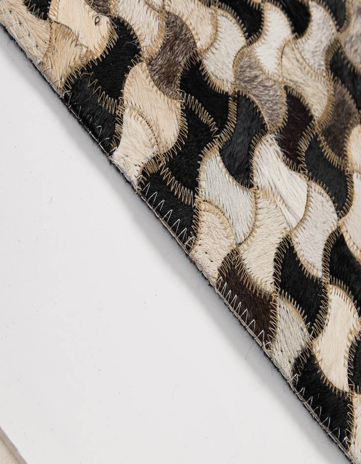 Detail image of  5' 1 x 7' 11 Cowhide - Patchwork Rug