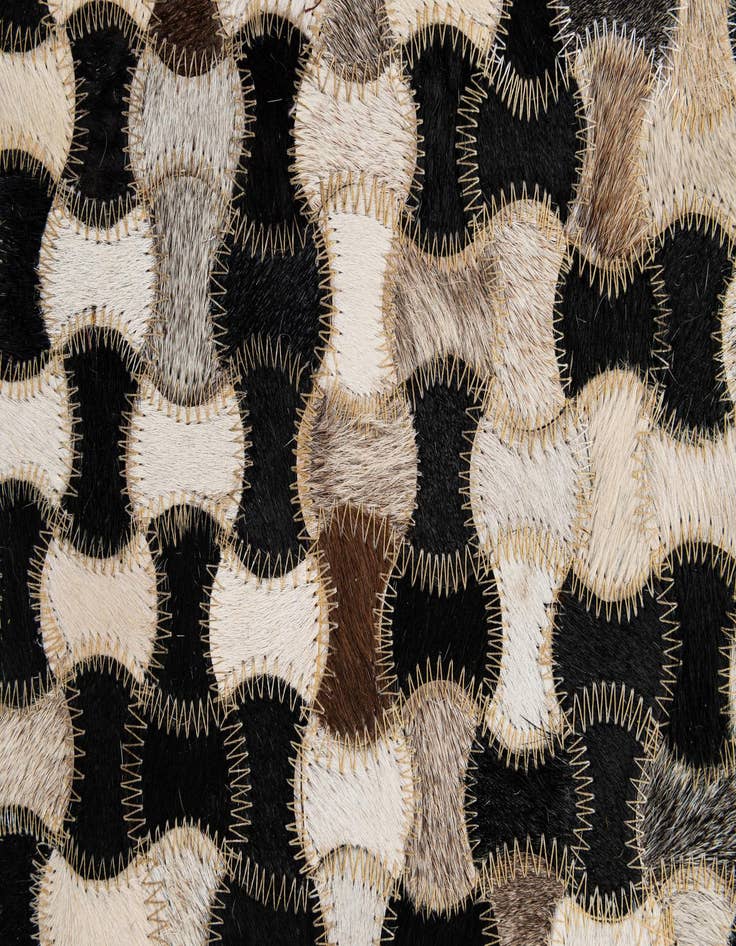 Detail image of  5' 1 x 7' 11 Cowhide - Patchwork Rug
