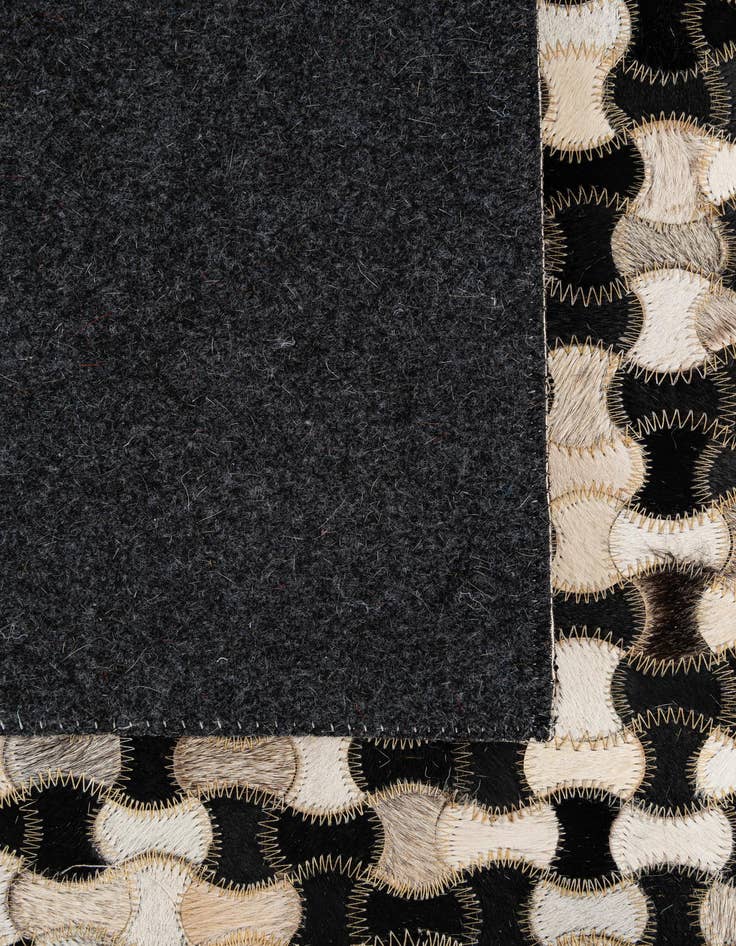 Detail image of  5' 1 x 7' 11 Cowhide - Patchwork Rug