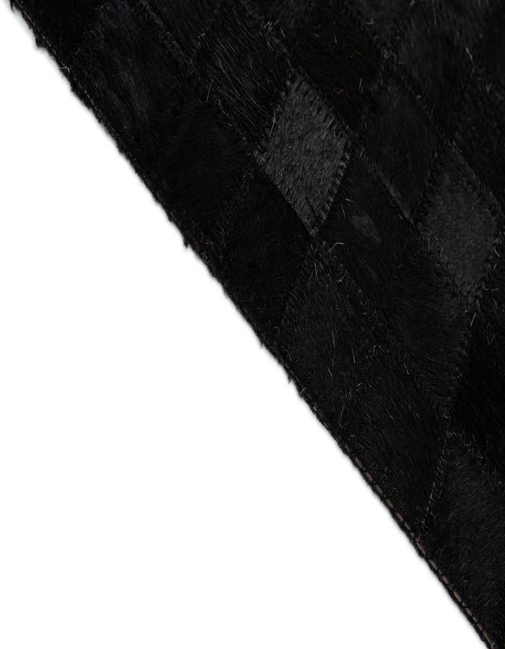 Detail image of  5' 1 x 7' 11 Cowhide - Patchwork Rug