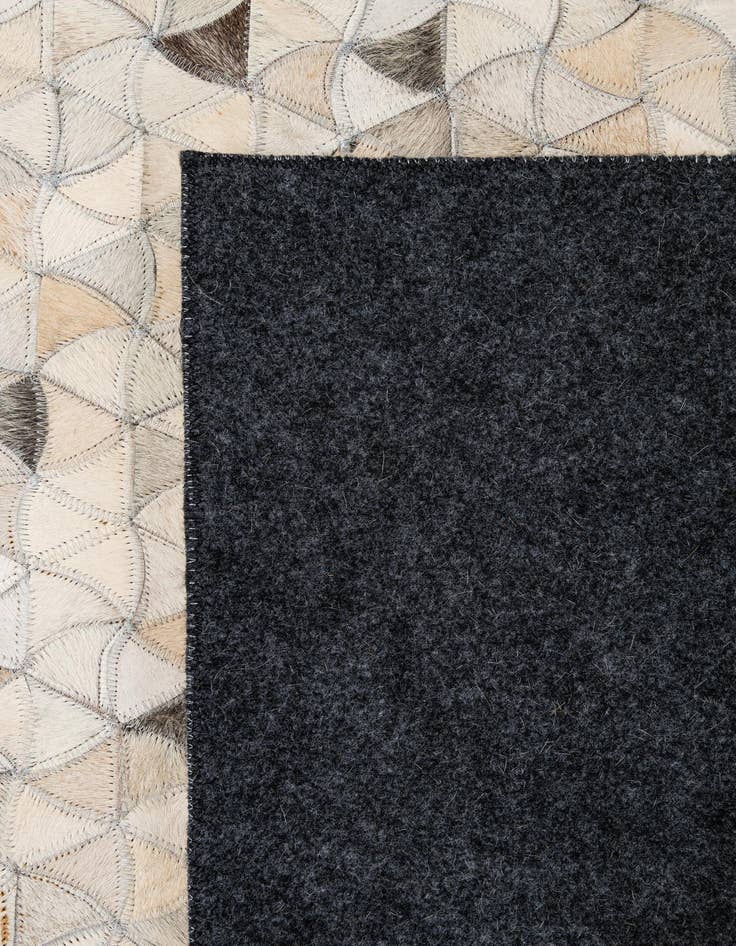 Detail image of  4' 10 x 7' 11 Cowhide - Patchwork Rug