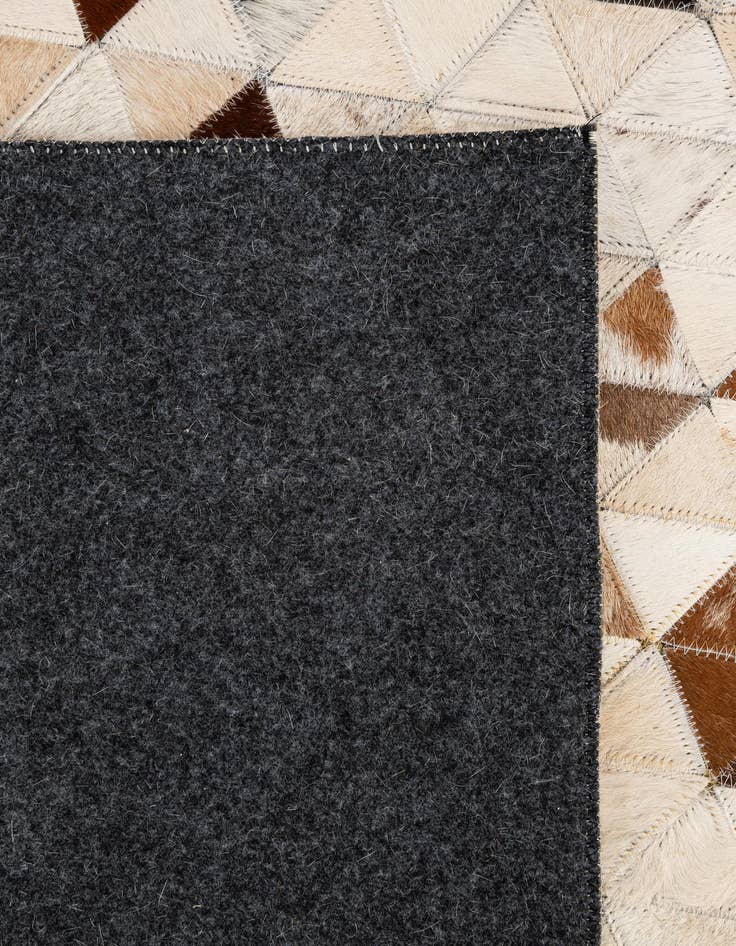 Detail image of  5' 1 x 7' 11 Cowhide - Patchwork Rug