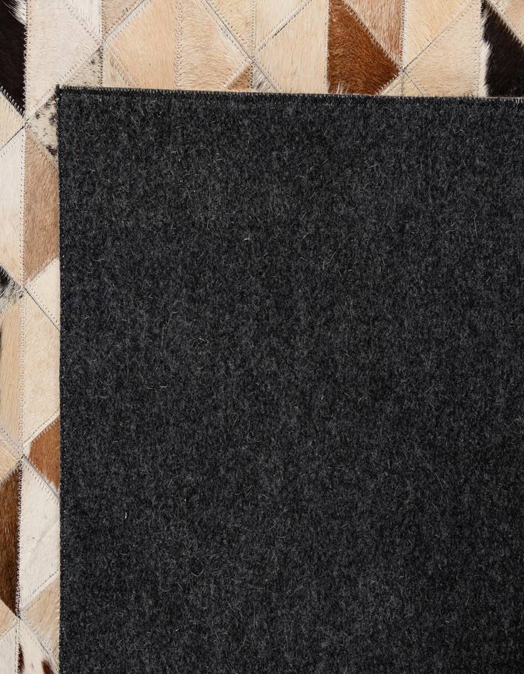 Detail image of  5' 1 x 7' 11 Cowhide - Patchwork Rug