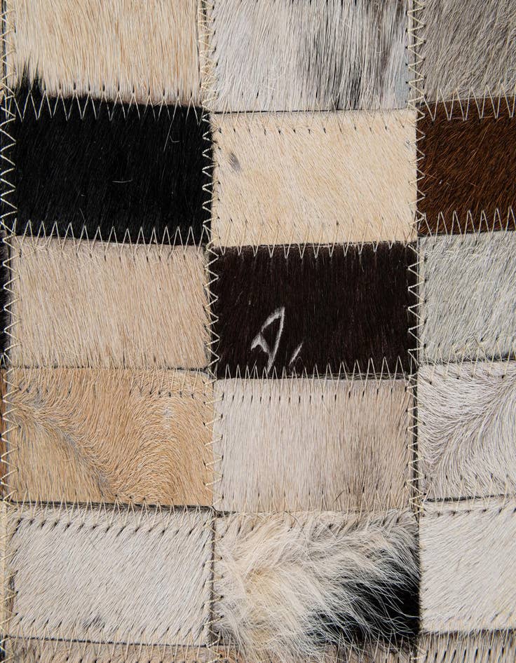 Detail image of  5' 2 x 7' 11 Cowhide - Patchwork Rug