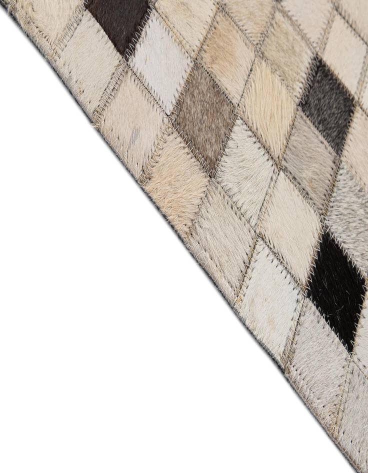 Detail image of  5' 1 x 7' 11 Cowhide - Patchwork Rug